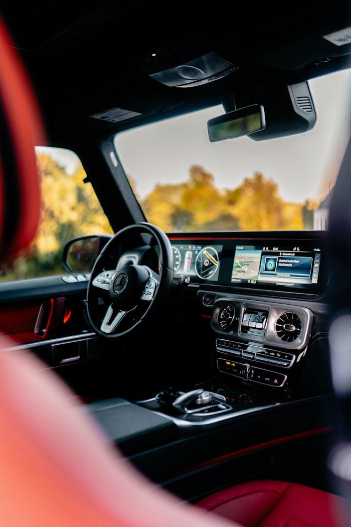 Luxury SUV interior showcasing an elegant dashboard and advanced features, perfect for automotive enthusiasts.
